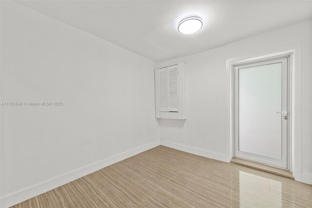 1690 Daytonia Rd, Miami Beach, FL 33141 - empty room with baseboards