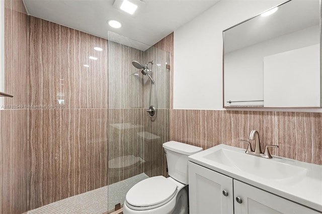 1690 Daytonia Rd, Miami Beach, FL 33141 - bathroom with tiled shower, toilet, vanity, tile walls, and recessed lighting