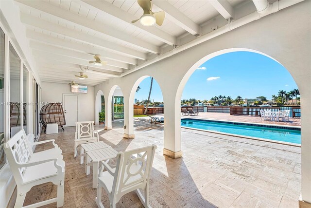 1690 Daytonia Rd, Miami Beach, FL 33141 - view of patio featuring ceiling fan and a community pool