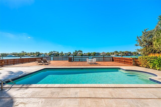 1690 Daytonia Rd, Miami Beach, FL 33141 - view of swimming pool featuring a fenced backyard and a patio