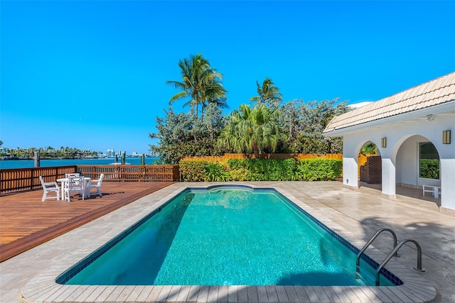 1690 Daytonia Rd, Miami Beach, FL 33141 - view of swimming pool featuring a deck with water view and a patio
