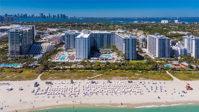 bird's eye view with a view of city, a view of the beach, and a water view