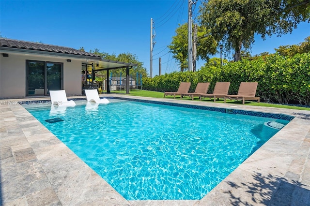 outdoor pool with a patio