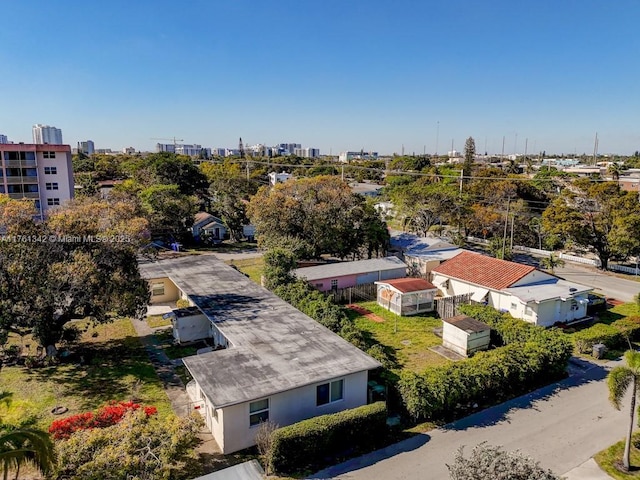 birds eye view of property with a view of city