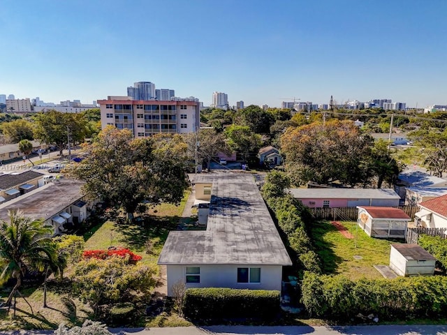 birds eye view of property with a view of city