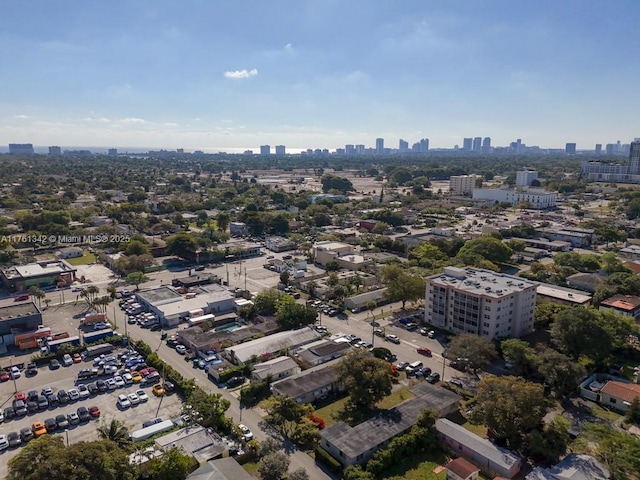 birds eye view of property featuring a city view