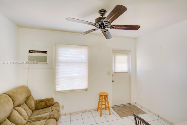 sitting room featuring ceiling fan