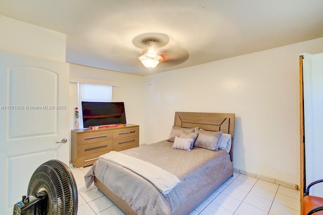 bedroom featuring light tile patterned floors and a ceiling fan