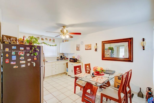 dining space with light tile patterned flooring and ceiling fan