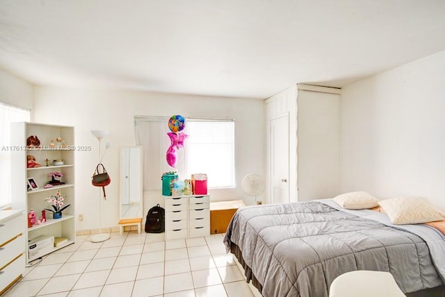 bedroom with light tile patterned floors