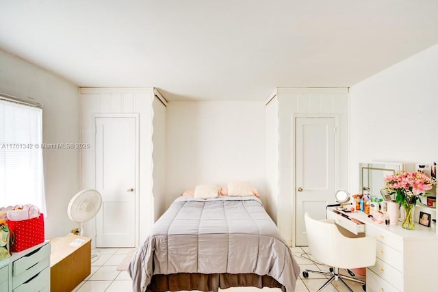 bedroom with light tile patterned flooring