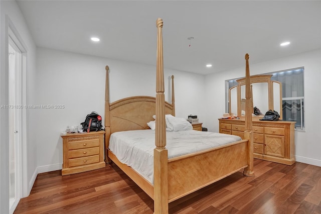 bedroom featuring recessed lighting, baseboards, and wood finished floors