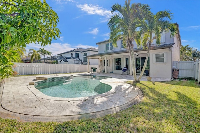 view of swimming pool featuring a patio, a fenced in pool, a fenced backyard, ceiling fan, and a lawn