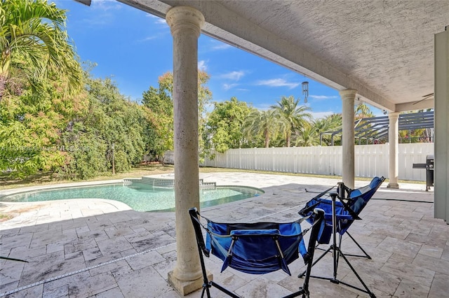 view of swimming pool featuring a fenced in pool, a fenced backyard, and a patio area