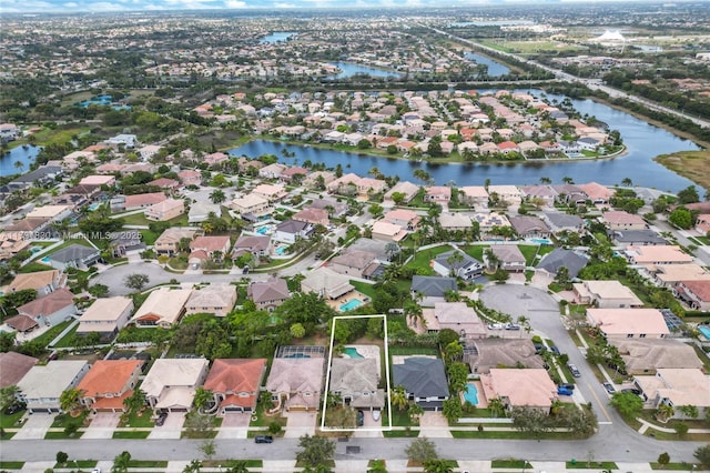 aerial view with a residential view and a water view