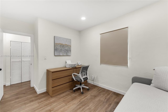 home office featuring recessed lighting, baseboards, and light wood-style flooring