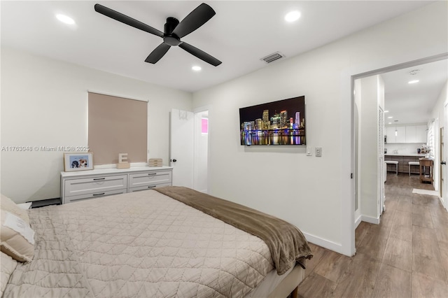 bedroom with a ceiling fan, baseboards, visible vents, recessed lighting, and light wood-type flooring