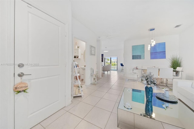 interior space featuring light tile patterned floors and visible vents