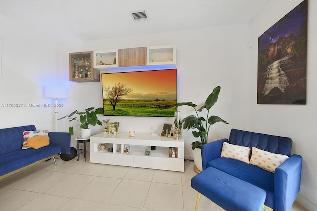 living room with visible vents and tile patterned flooring