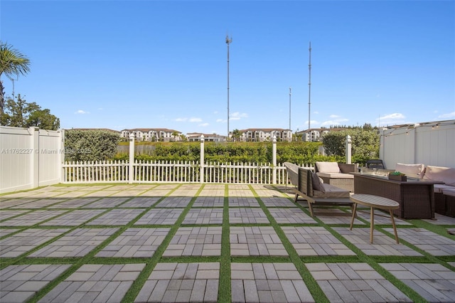 view of patio featuring an outdoor hangout area and fence