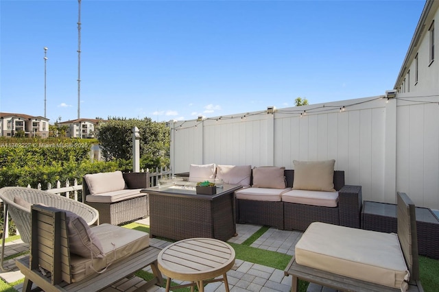 view of patio / terrace featuring fence and an outdoor hangout area