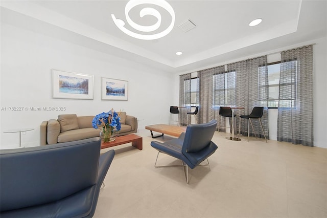 home office featuring recessed lighting, a tray ceiling, and visible vents