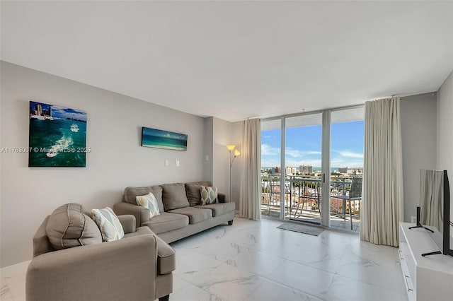 living room featuring marble finish floor and floor to ceiling windows