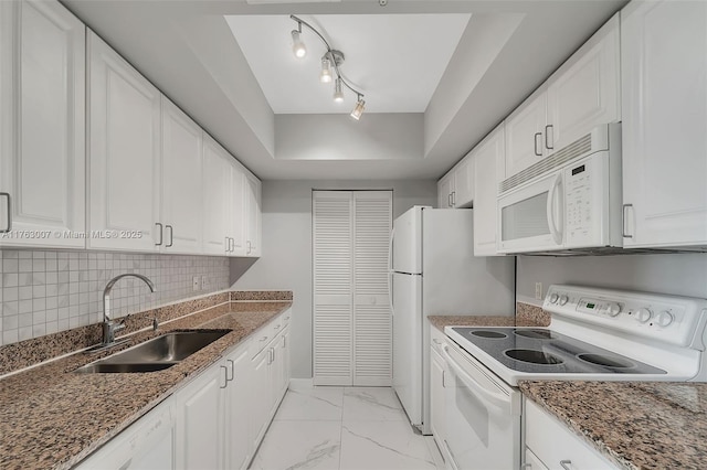 kitchen with marble finish floor, white appliances, white cabinetry, and a sink