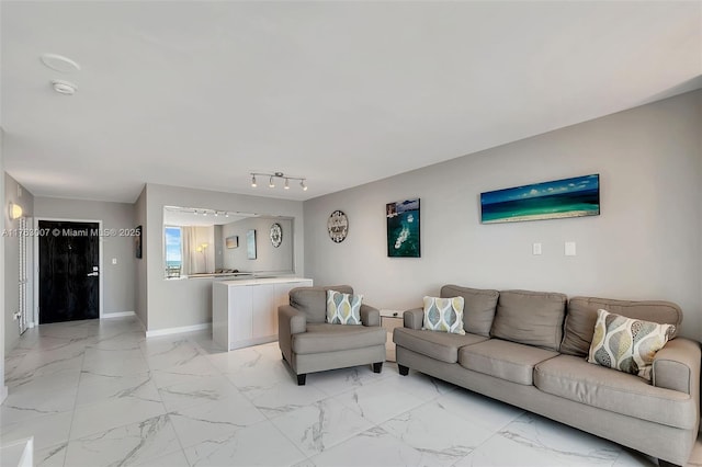 living area with marble finish floor and baseboards