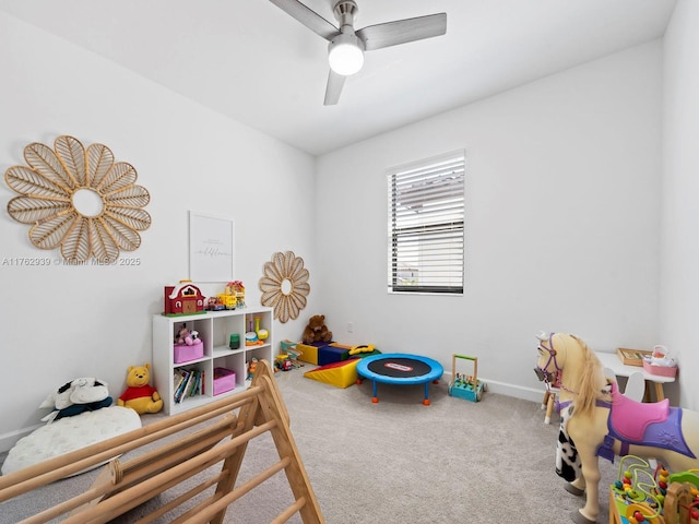 rec room featuring baseboards, carpet floors, and ceiling fan