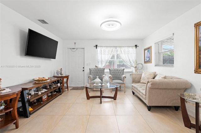 living room with light tile patterned floors and visible vents