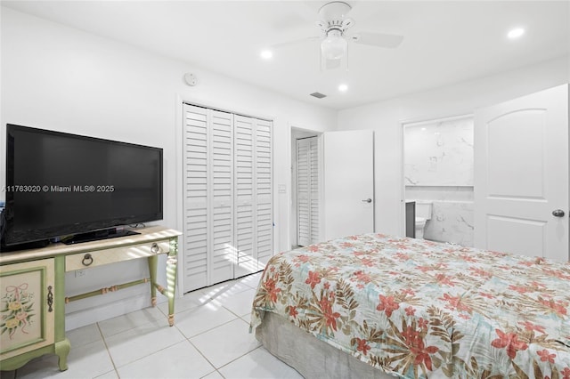 bedroom with recessed lighting, light tile patterned floors, visible vents, and a closet