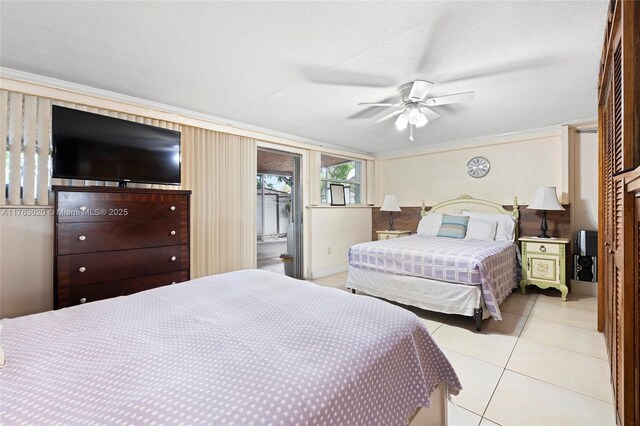 bedroom featuring access to exterior, ornamental molding, light tile patterned floors, and ceiling fan