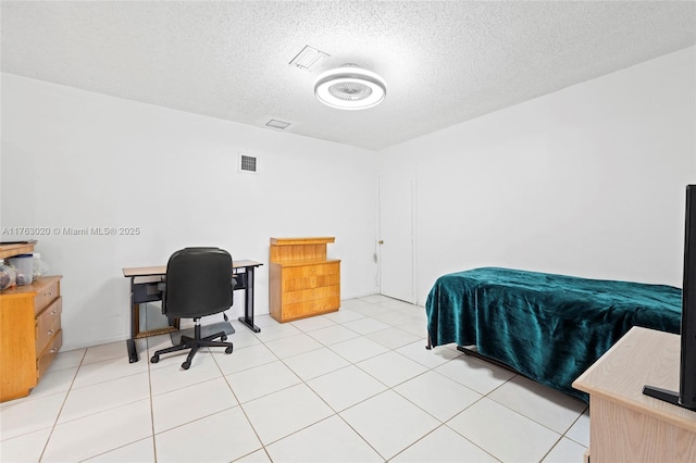 bedroom with visible vents and a textured ceiling