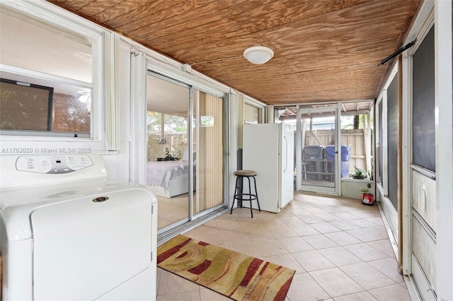 sunroom / solarium with washer / dryer and wooden ceiling