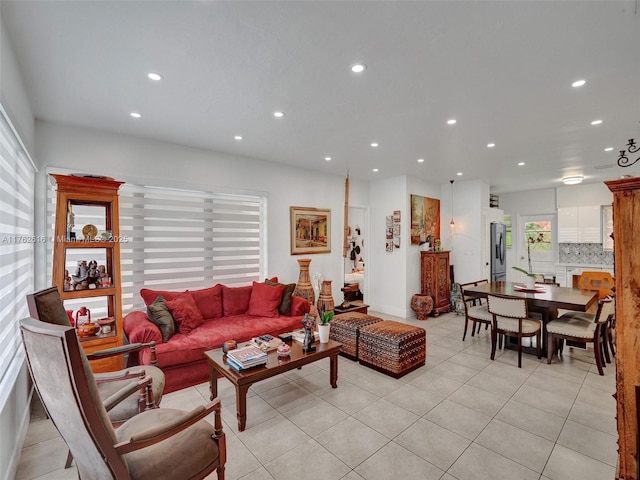 living area with light tile patterned floors and recessed lighting