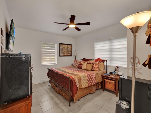 bedroom with light tile patterned floors and ceiling fan