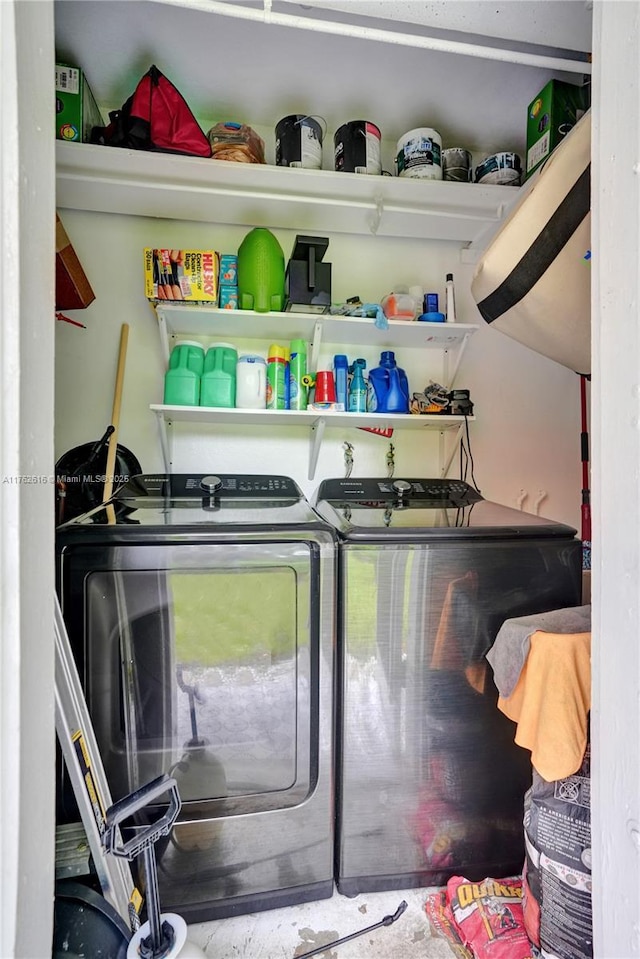 washroom featuring laundry area and washer and clothes dryer