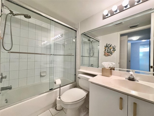 full bathroom with tile patterned floors, visible vents, toilet, bath / shower combo with glass door, and vanity