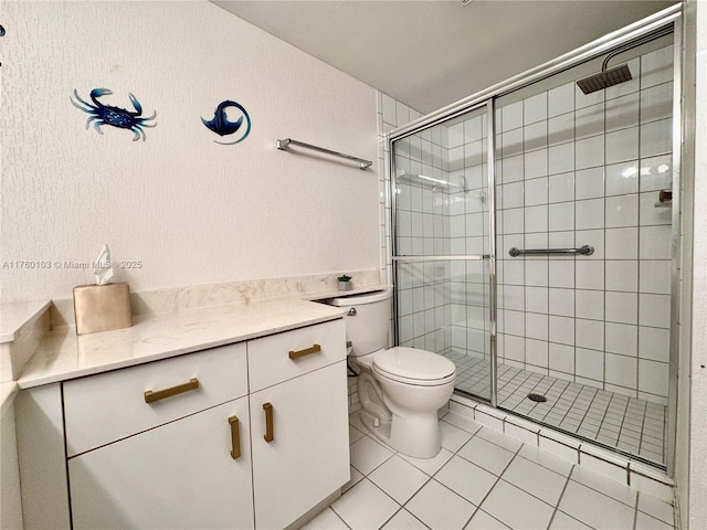 full bath featuring a shower stall, toilet, and tile patterned floors