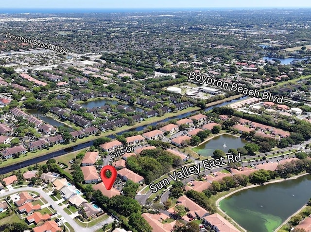 bird's eye view with a residential view and a water view