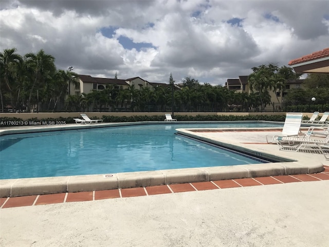 9015 SW 125th Ave Unit N109, Miami, FL 33186 - community pool featuring fence and a patio area