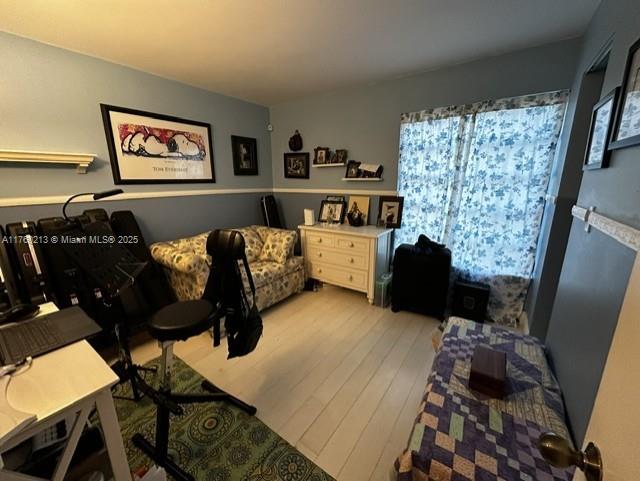 bedroom with light wood-type flooring