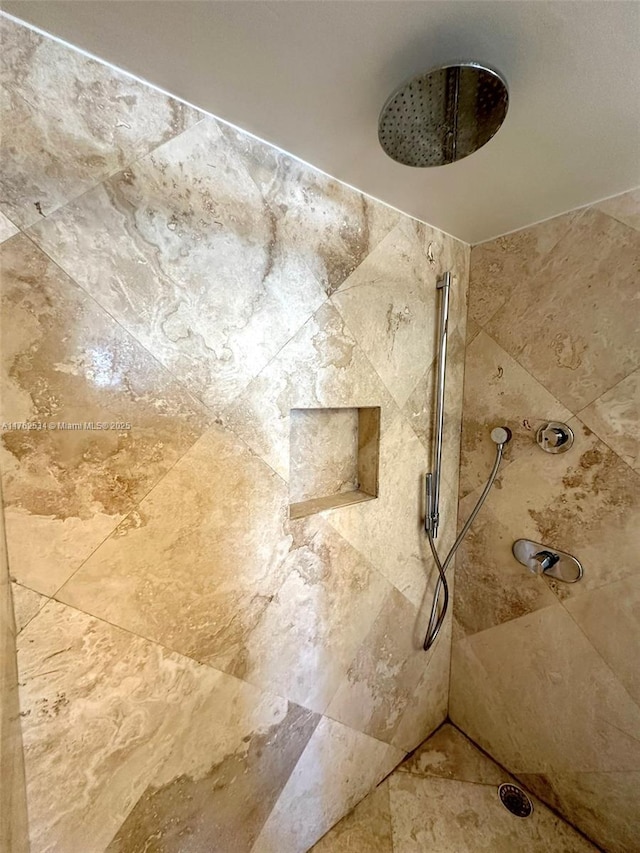 full bath with a tile shower