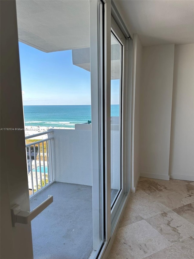 balcony with a view of the beach and a water view