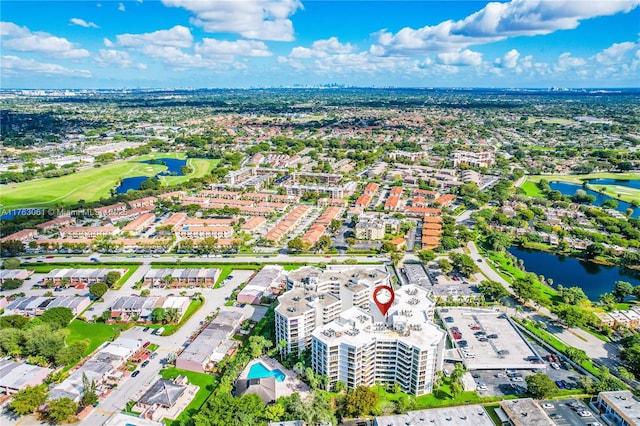 aerial view featuring golf course view and a water view