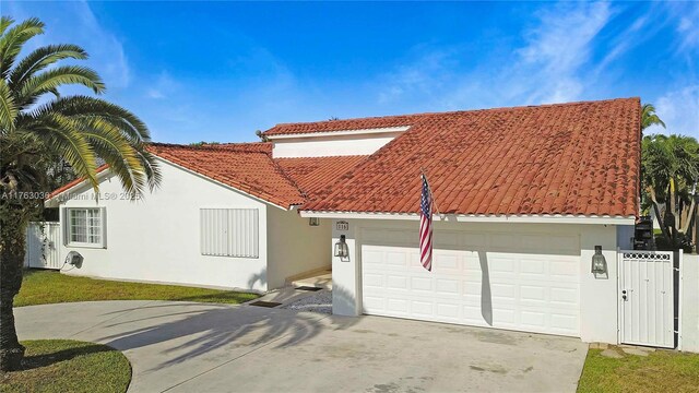 116 SW 135th Ave, Miami, FL 33184 - doorway to property with stucco siding and a tile roof