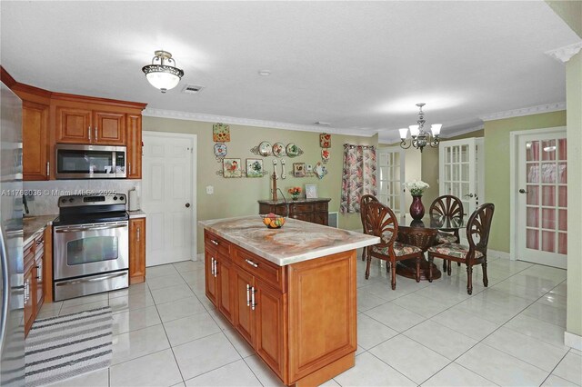 116 SW 135th Ave, Miami, FL 33184 - kitchen with light countertops, a sink, light tile patterned floors, and appliances with stainless steel finishes