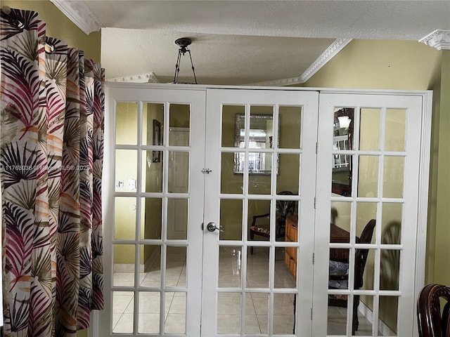 doorway to outside featuring tile patterned flooring, french doors, and a textured ceiling