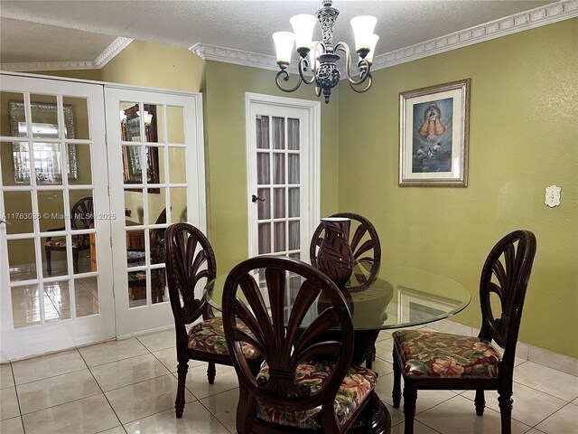 dining room featuring light tile patterned floors, french doors, a textured ceiling, crown molding, and a notable chandelier